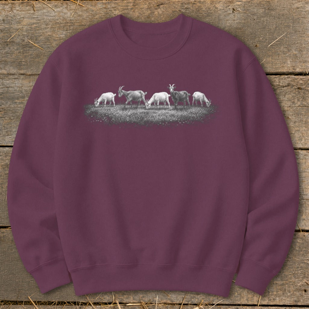 Maroon sweatshirt with a graphic of five goats grazing on grass.