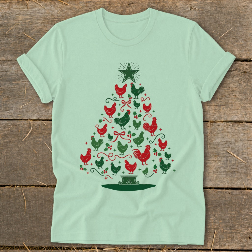 Light green t-shirt with a Christmas tree made of red and green chickens and holly.