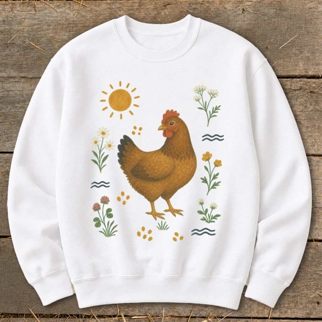 White sweatshirt with a brown chicken surrounded by flowers and the sun.