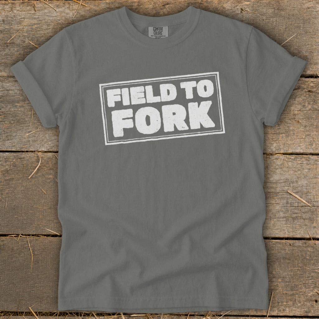Charcoal gray short-sleeve crewneck t-shirt with the white distressed text Field to Fork centered on the chest.