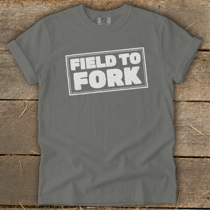 Charcoal gray short-sleeve crewneck t-shirt with the white distressed text Field to Fork centered on the chest.