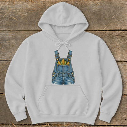 White hoodie with a graphic of denim overalls filled with corn cobs.