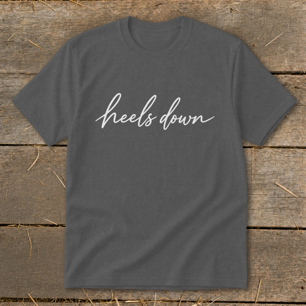 Charcoal t-shirt with white cursive text "heels down".