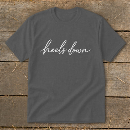 Charcoal t-shirt with white cursive text "heels down".