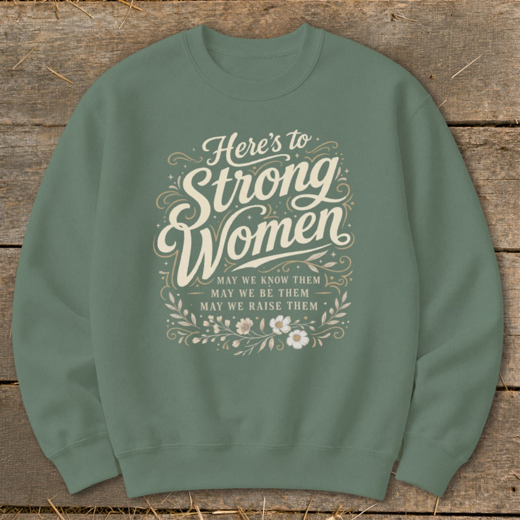 Green sweatshirt with "Here's to Strong Women" and floral design.