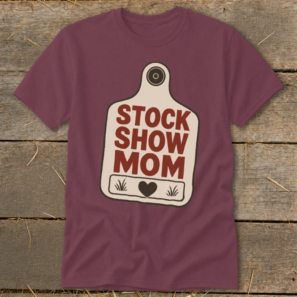 Maroon t-shirt with "STOCK SHOW MOM" text on a tag graphic.