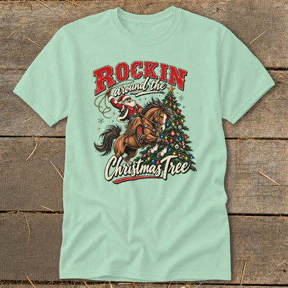 Santa riding a horse with a lasso next to a Christmas tree with text.