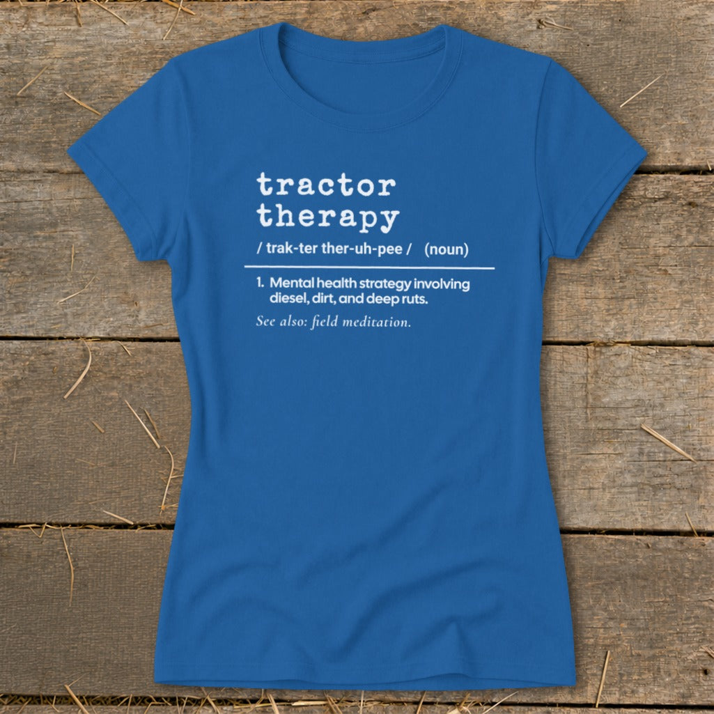 Blue t-shirt with white text defining "tractor therapy" as a mental health strategy.