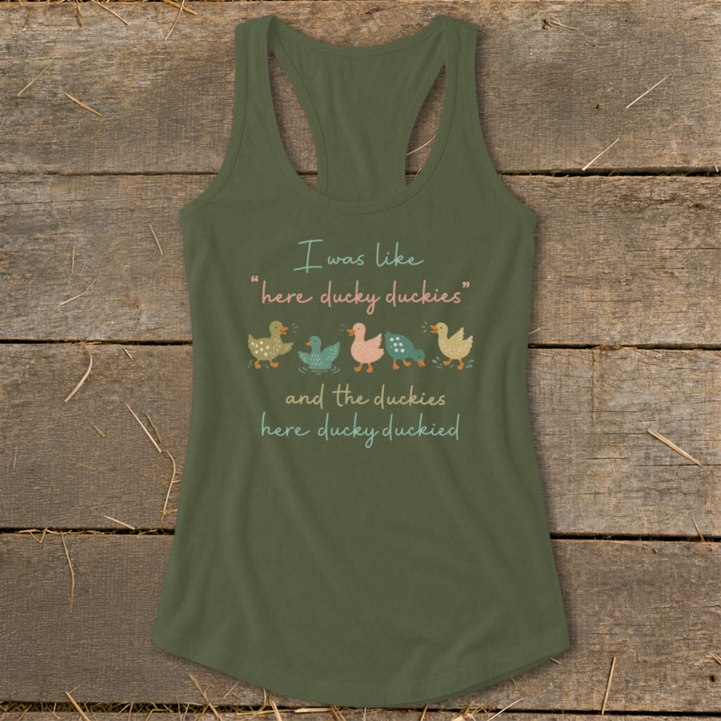 Green tank top with text "I was like 'here ducky duckies' and the duckies here ducky duckied" and five ducks.