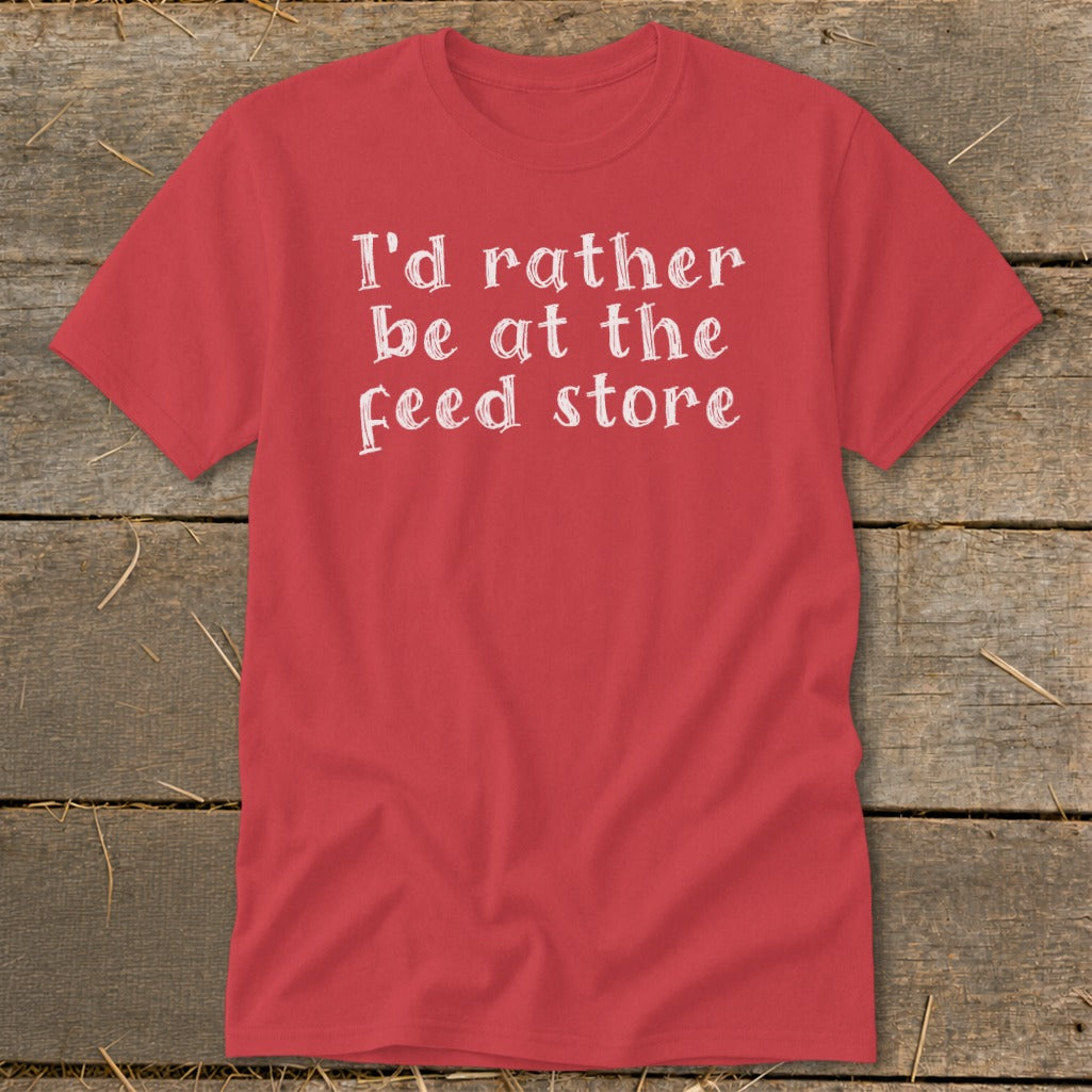 Red t-shirt with white text reading "I'd rather be at the feed store".
