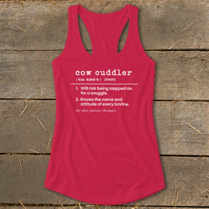 Pink tank top with white text defining "cow cuddler" and its characteristics.