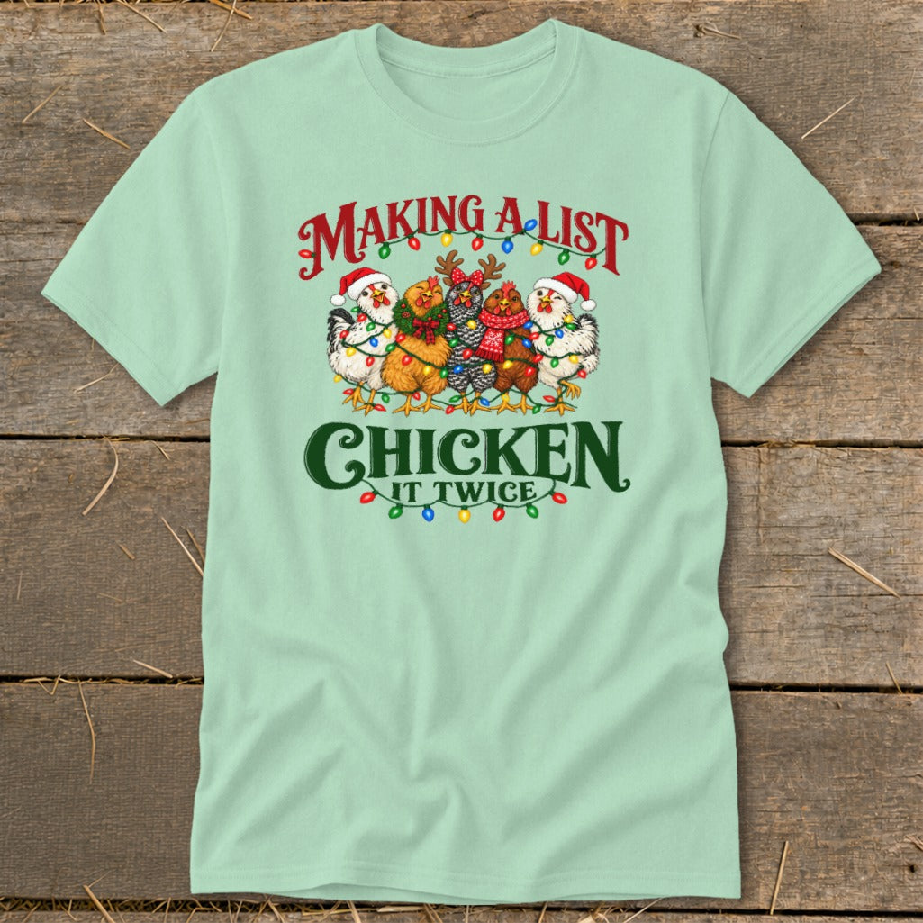 Mint green t-shirt with chickens wearing Santa hats and Christmas lights, text reads "Making a list, Chicken it twice."