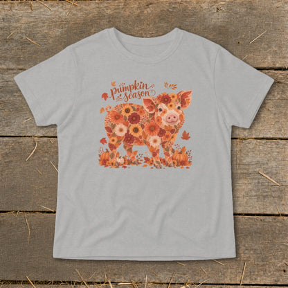 Pig made of flowers and leaves with "pumpkin season" text and pumpkins.