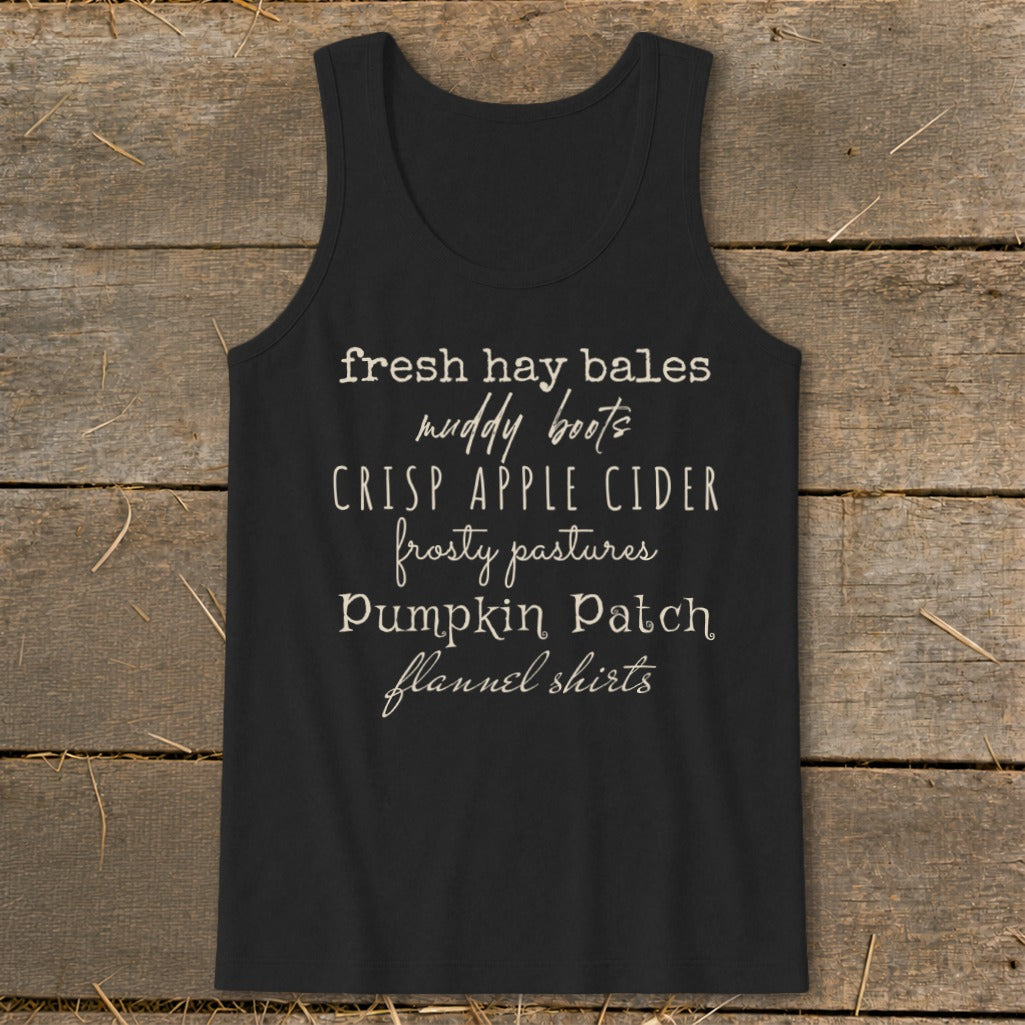 Black tank top with fall-themed text: fresh hay bales, muddy boots, crisp apple cider.