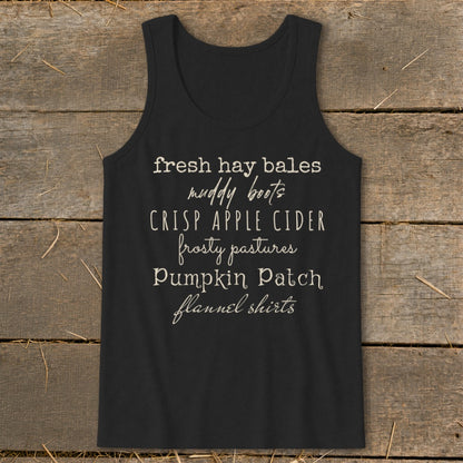 Black tank top with fall-themed text: fresh hay bales, muddy boots, crisp apple cider.