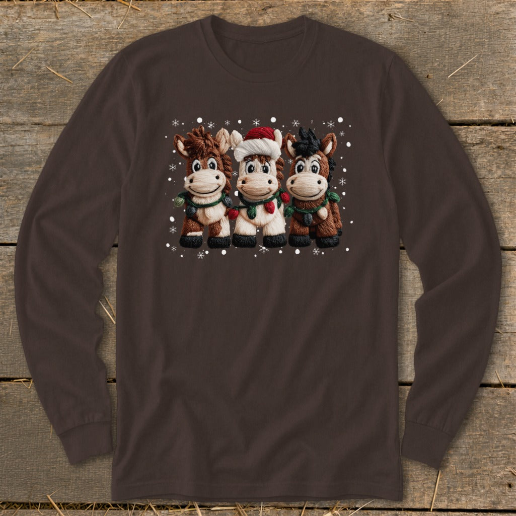 Three cartoon horses wear Christmas lights and a Santa hat, surrounded by snowflakes.