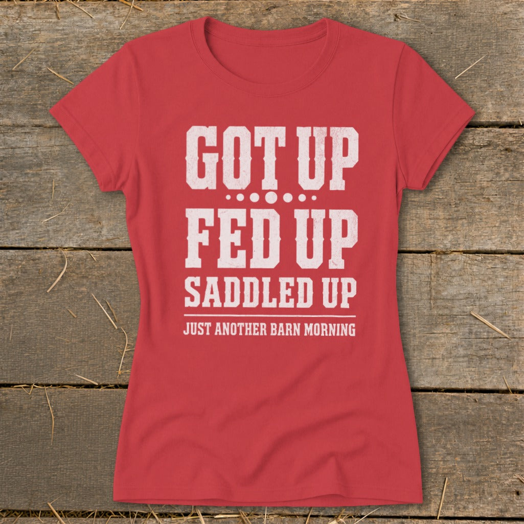 Red t-shirt with white text: GOT UP FED UP SADDLED UP JUST ANOTHER BARN MORNING.