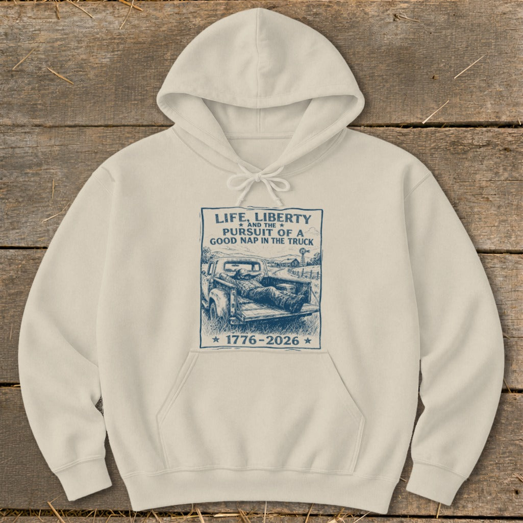 Cream hoodie with "Life, Liberty, and the Pursuit of a Good Nap in the Truck" graphic.