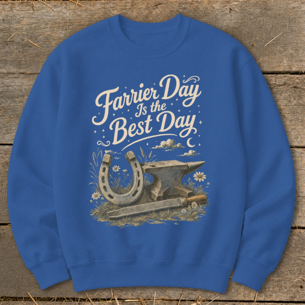 Blue sweatshirt with "Farrier Day Is the Best Day" graphic featuring horseshoe, anvil, and file.