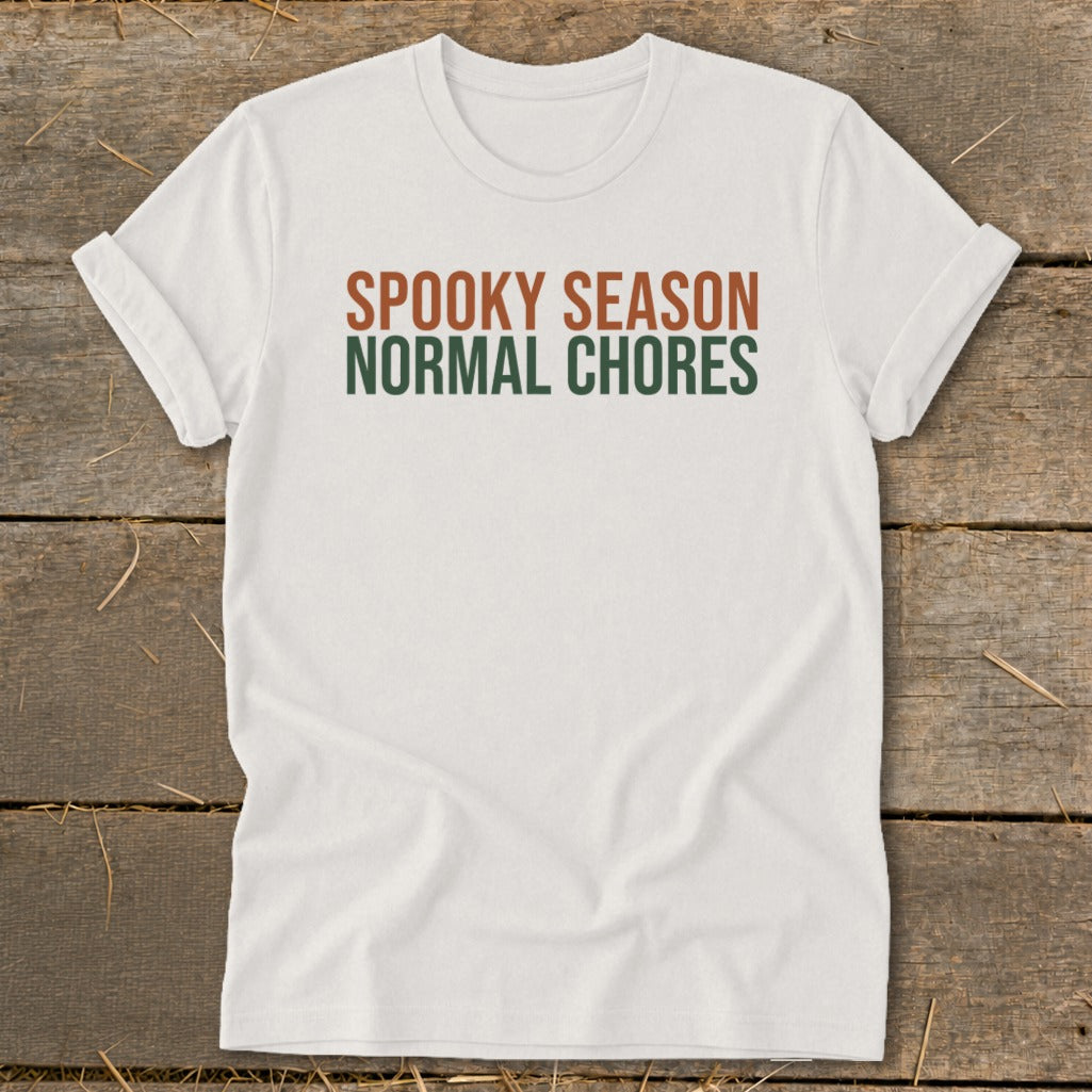 White t-shirt with "Spooky Season Normal Chores" text.