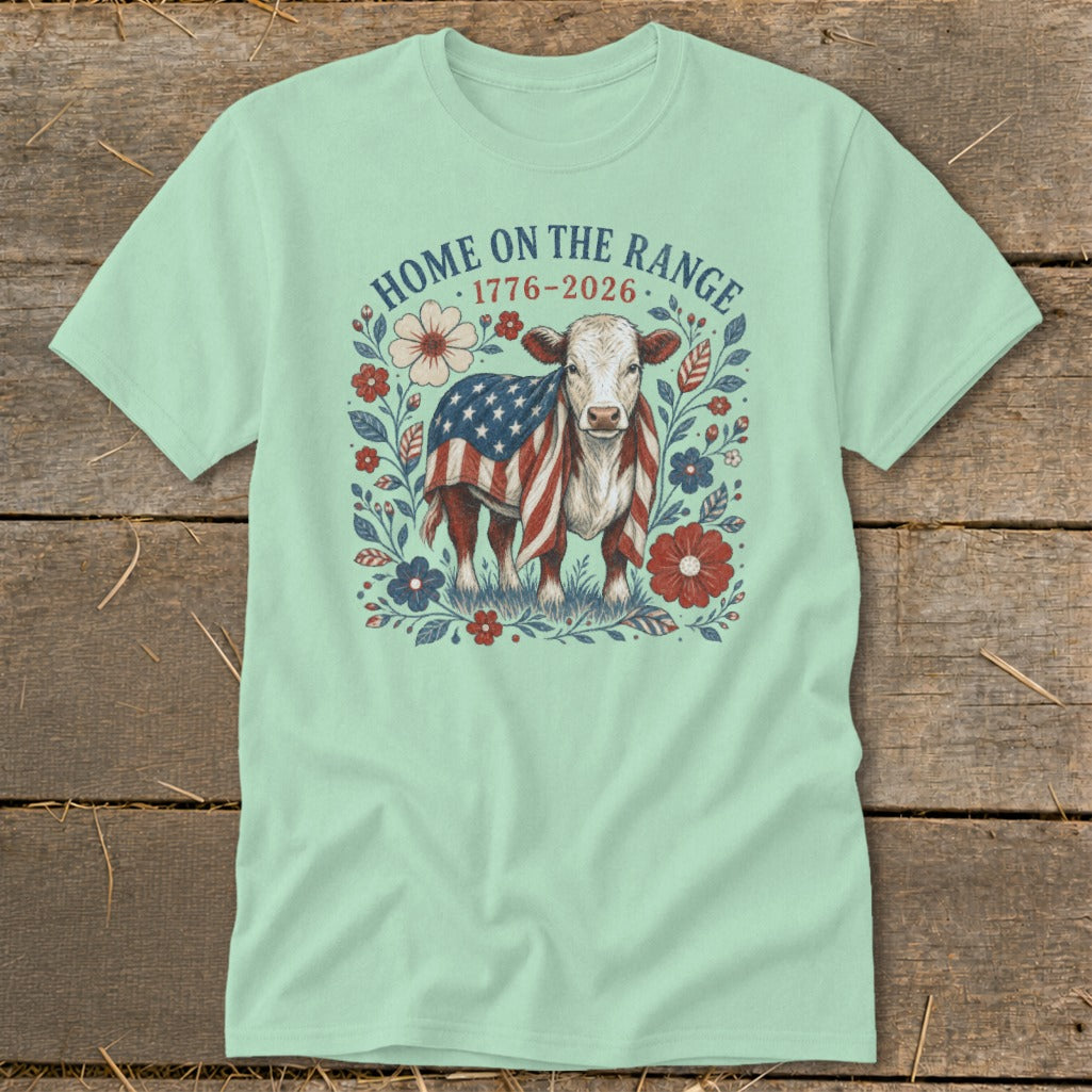 Cow draped in American flag with "Home on the Range 1776-2026" text.
