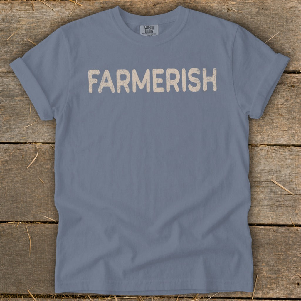 Blue t-shirt with "FARMERISH" in beige distressed lettering.