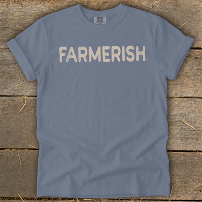 Blue t-shirt with "FARMERISH" in beige distressed lettering.
