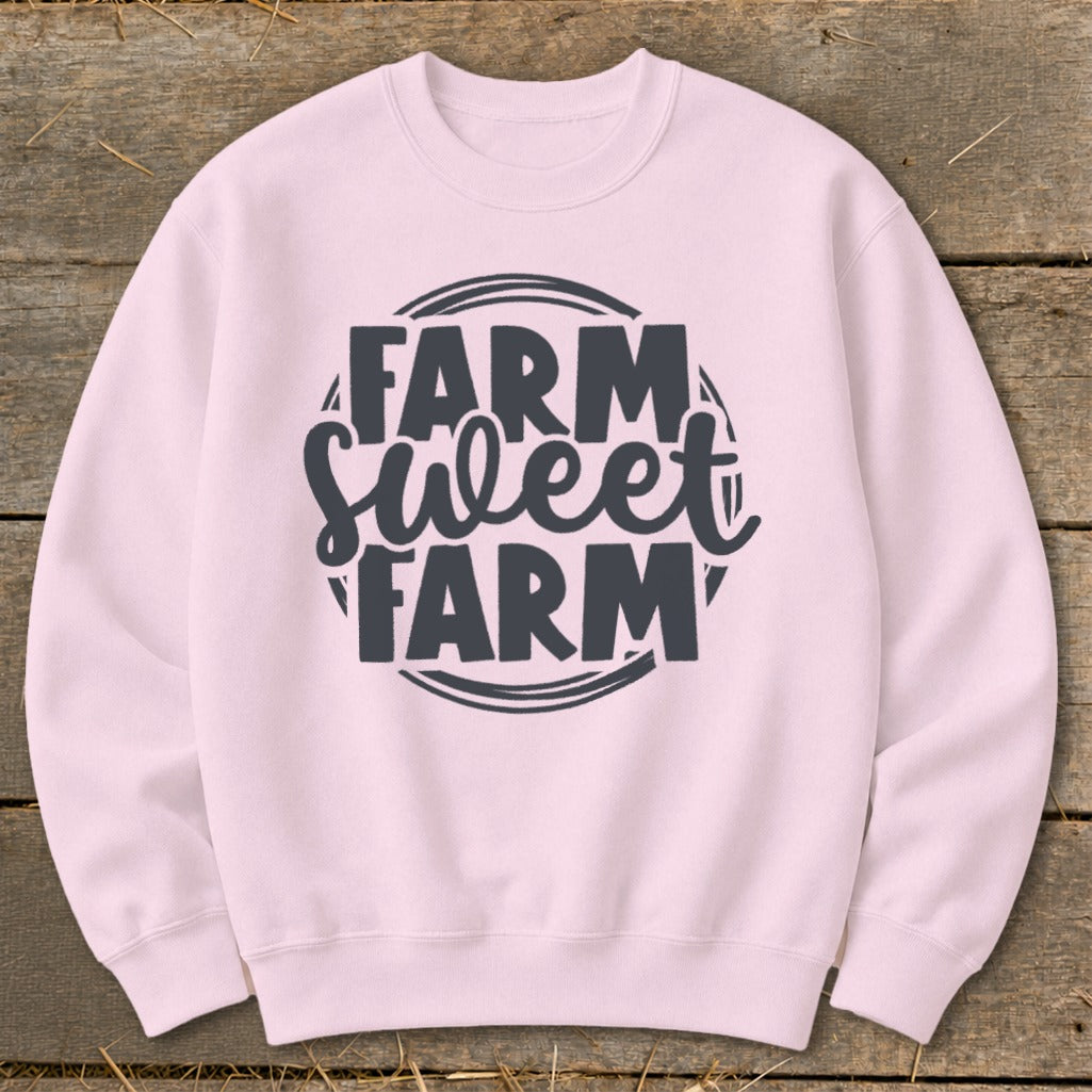 Pink sweatshirt with "Farm Sweet Farm" text design.