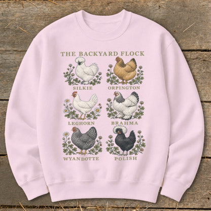 Pink sweatshirt with "The Backyard Flock" and six chicken illustrations: Silkie, Orpington, Leghorn, Brahma, Wyandotte, Polish.
