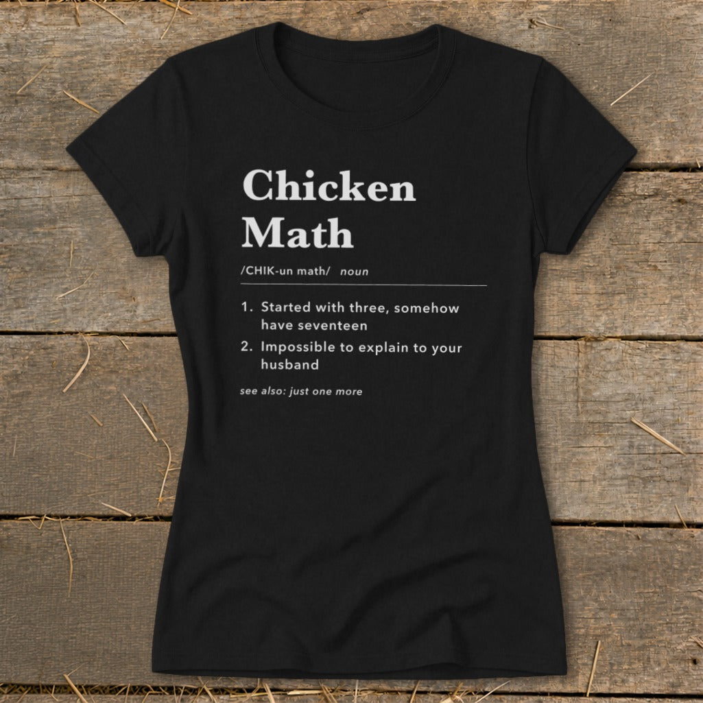 Black t-shirt with white text defining "Chicken Math" with humorous examples.