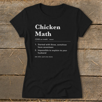 Black t-shirt with white text defining "Chicken Math" with humorous examples.