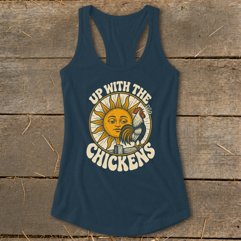 Dark blue racerback tank top featuring a graphic of a rooster, a smiling sun, and the text Up With The Chickens.