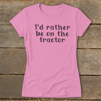 Pink t-shirt with black text that reads "I'd rather be on the tractor".