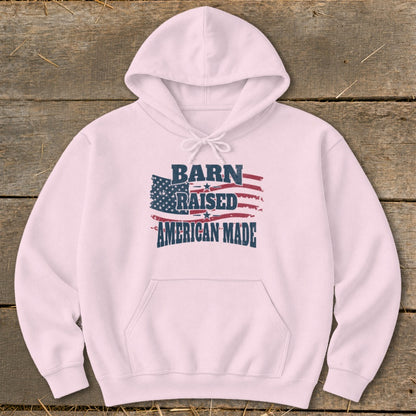 Pink hoodie with "Barn Raised American Made" text and American flag graphic.