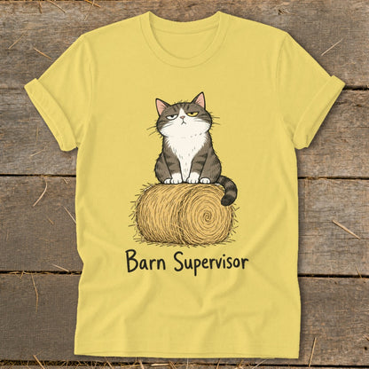 Yellow t-shirt with a grumpy cat sitting on a hay bale, text reads "Barn Supervisor".