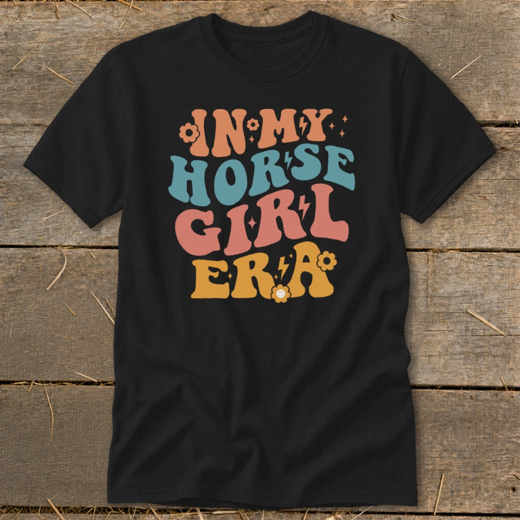 Black t-shirt with "IN MY HORSE GIRL ERA" text in colorful retro font.
