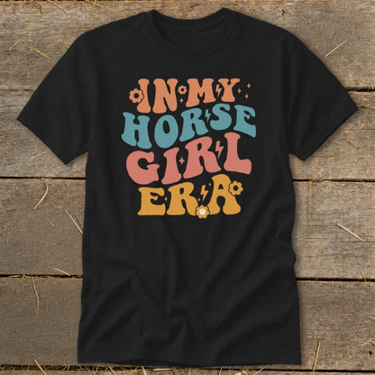 Black t-shirt with "IN MY HORSE GIRL ERA" text in colorful retro font.
