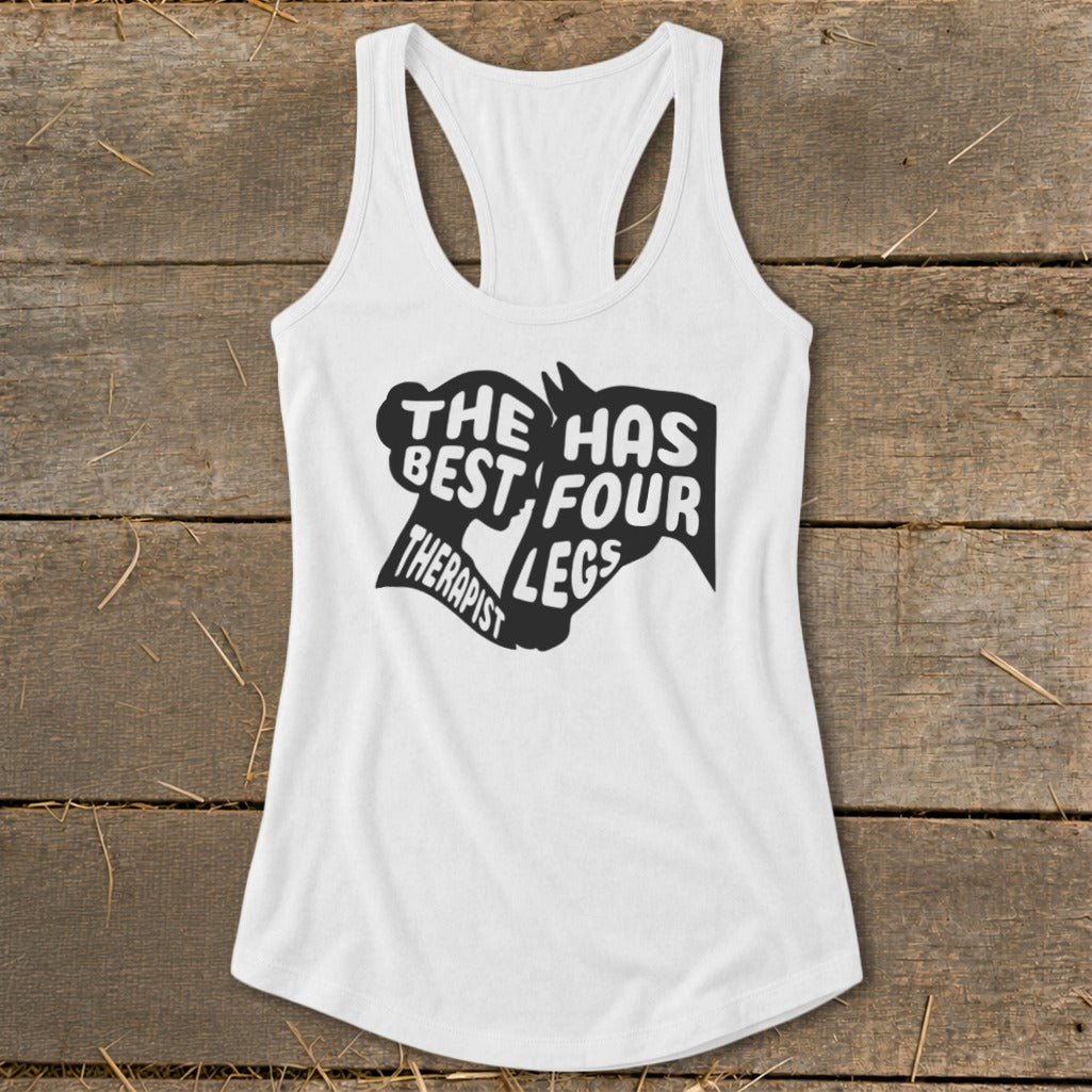White tank top with "The Best Therapist Has Four Legs" text and horse graphic.
