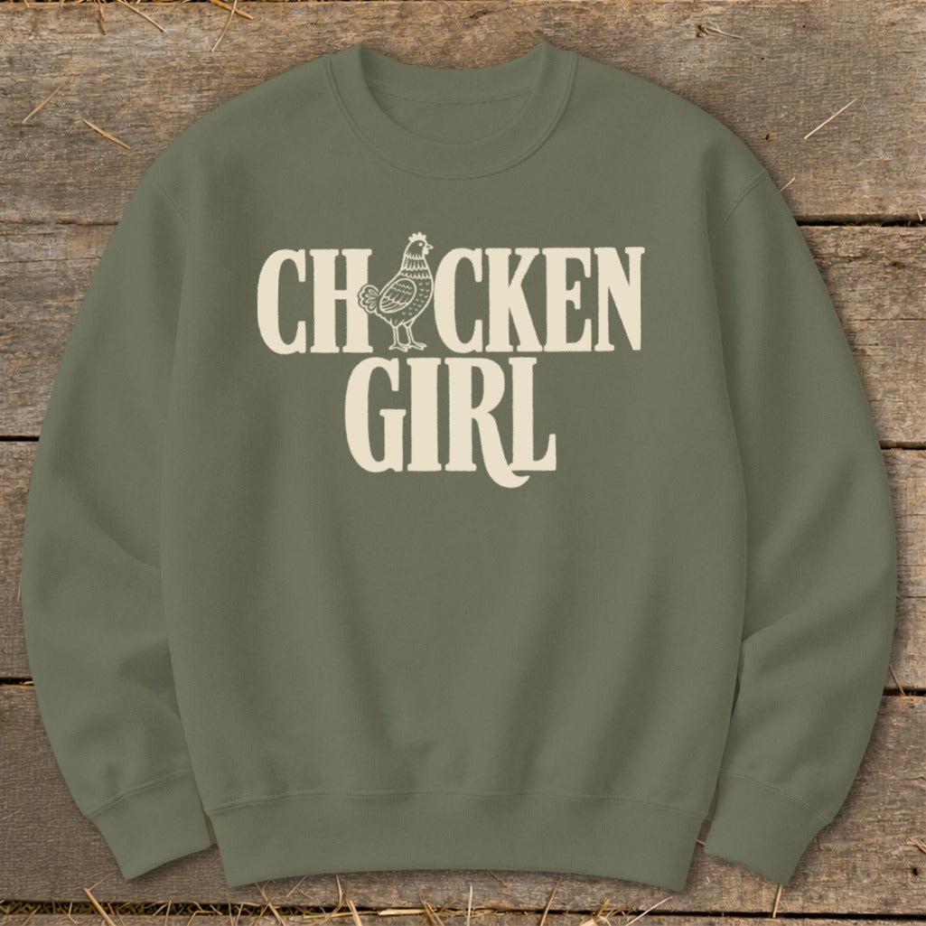 Olive green sweatshirt with white "CHICKEN GIRL" text and chicken graphic.