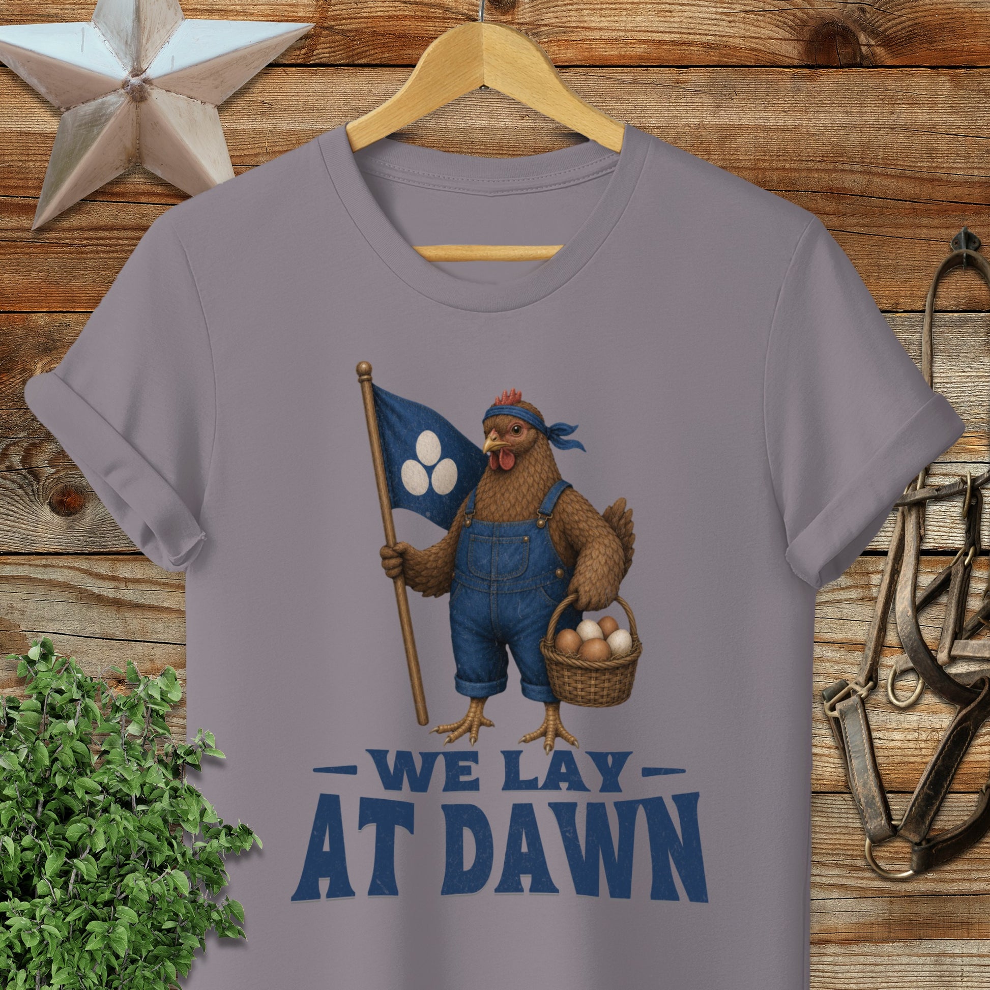 T-shirt with illustration of a chicken holding a flag and basket of eggs.