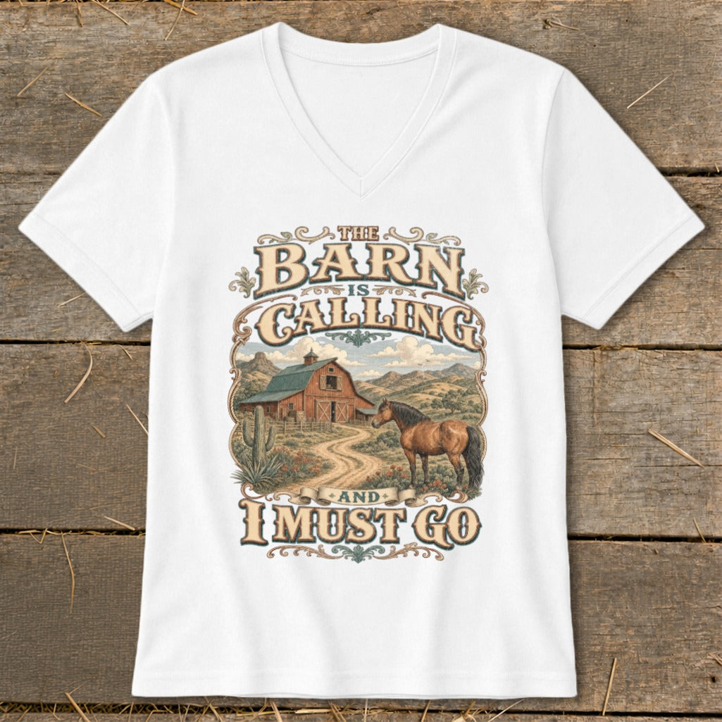 White v-neck t-shirt with "The Barn Is Calling and I Must Go" text and barn/horse graphic.