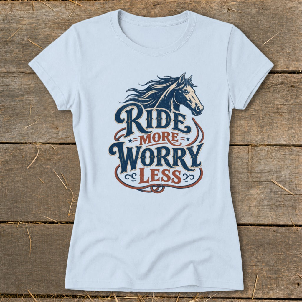 Light blue t-shirt with horse graphic and "Ride More Worry Less" text.