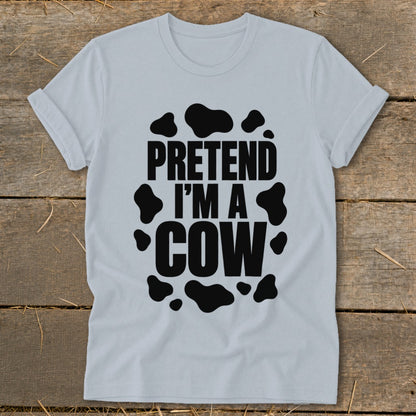 Light grey t-shirt with black "PRETEND I'M A COW" text and cow spots.