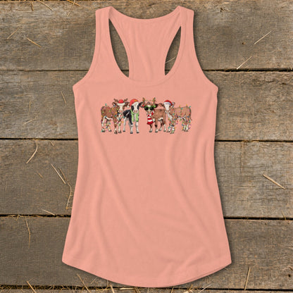 Peach tank top with a graphic of cows in Christmas hats and lights.