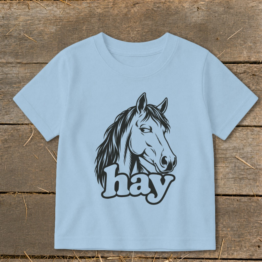 Light blue t-shirt with black horse head and "hay" text graphic.
