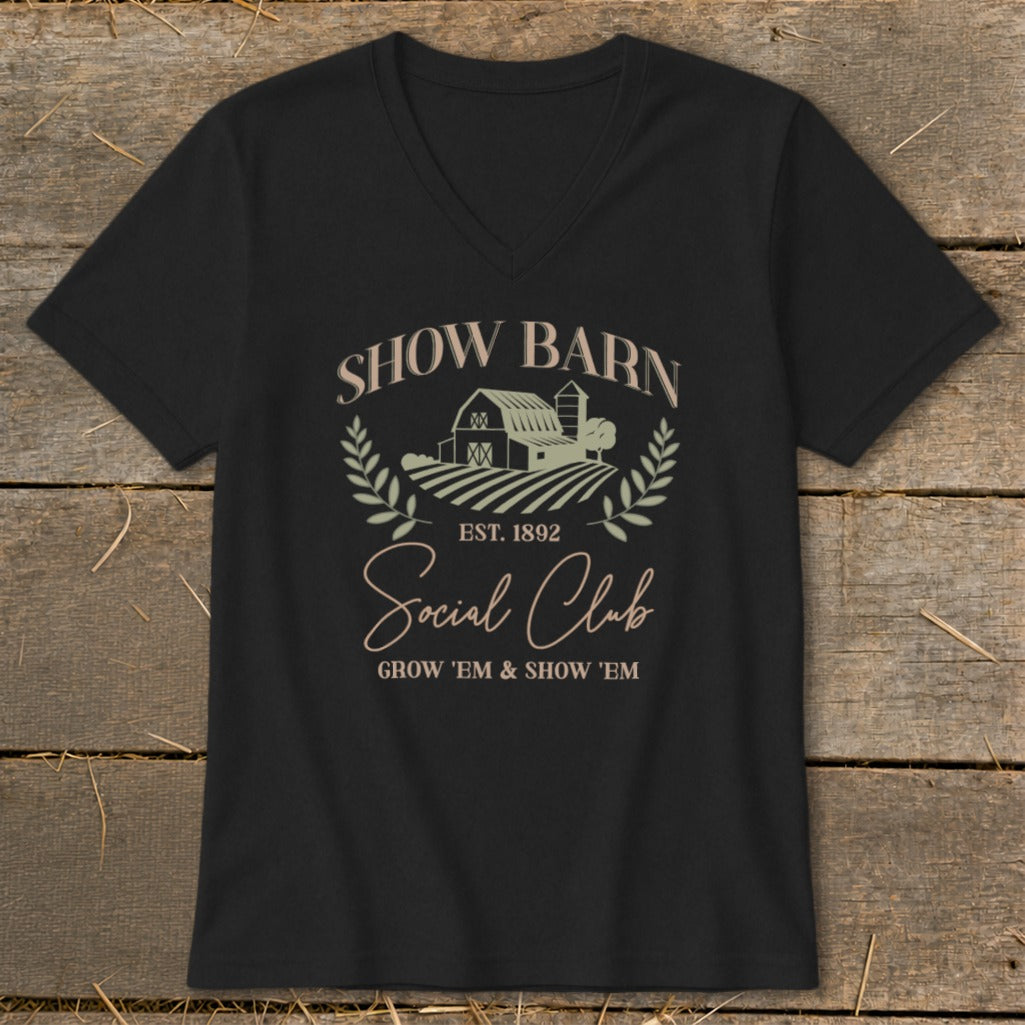 Black v-neck t-shirt with "Show Barn Social Club EST. 1892" text and barn graphic.