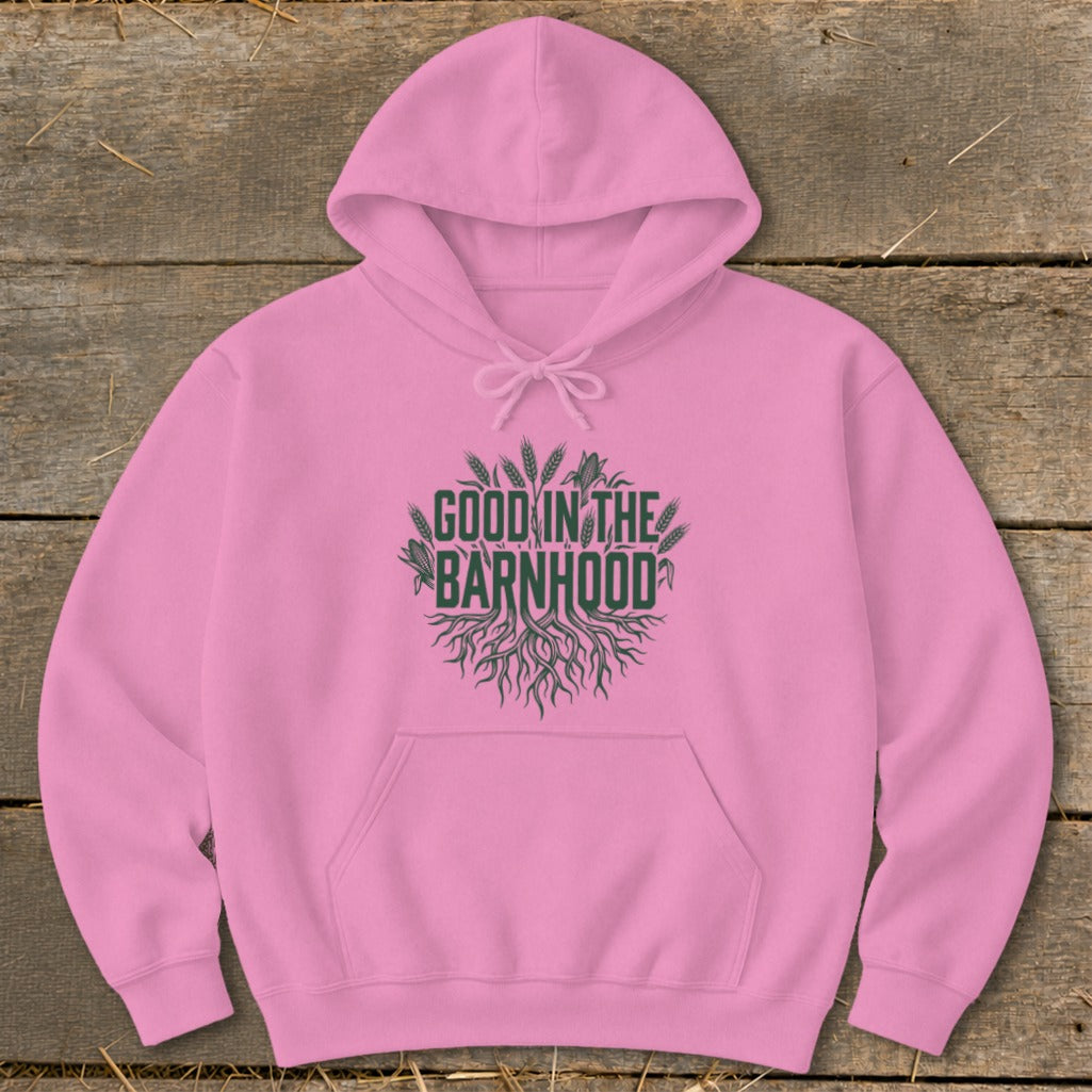 Pink hoodie with a green graphic featuring roots and wheat, reading "GOOD IN THE BARNHOOD".