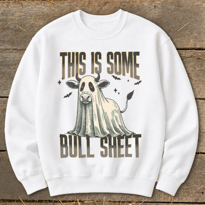 White sweatshirt with ghost cow graphic and "This is Some Bull Sheet" text.