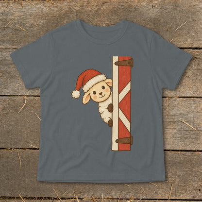Sheep wearing Santa hat peeking from barn door graphic on grey t-shirt.