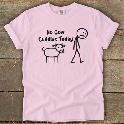 Light pink t-shirt with black graphic: "No Cow Cuddles Today" and stick figures of a sad cow and person.